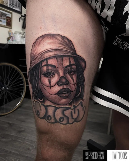 Big Chicano Woman in Hat with Clown Face and Script Tattoo on Men Thigh by @jamiepredgentattoos