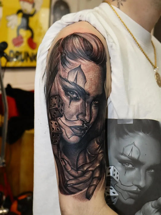 Big Chicano Woman with Dice and Leopard Tattoo on Men Arm by @jamiehopkinstattooist