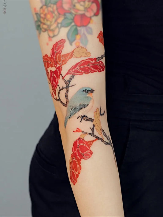 Big Chinese Blue Bird Red Flowers Tattoo on Women Arm by @tattoo.vinc