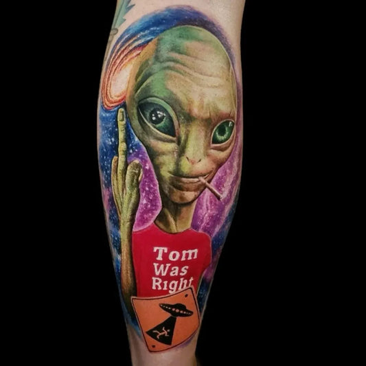Big Color Realism Alien with Tom Was Right Shirt and UFO Tattoo on Men Leg by @exodustattoostudiosnewyork