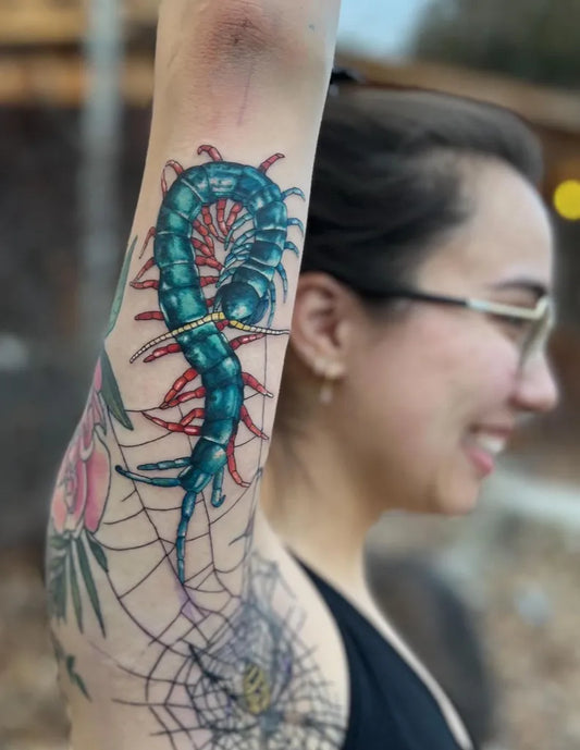Big Color Realism Centipede Web and Roses Tattoo on Women Arm by @linzihungerfordtattoos