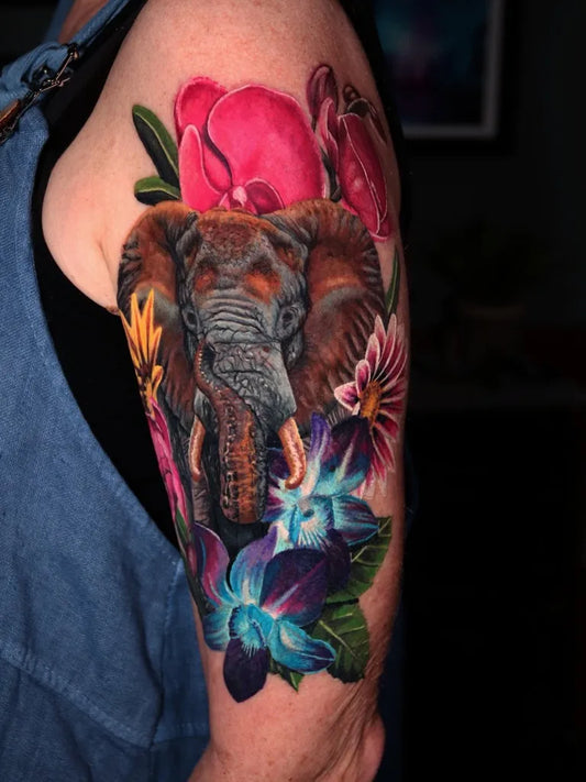 Big Color Realism Elephant and Flowers Tattoo on Women Arm by @winterhalo