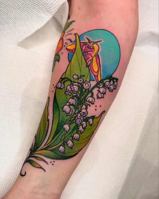 Big Color Realism Lily of the Valley Bird and Sun Women Arm Tattoo by @paulendresjr