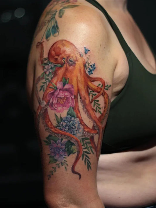 Big Color Realism Orange Octopus and Flowers Tattoo on Women Arm by @_duygutopcu
