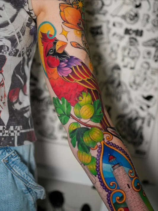 Big Colorful Cardinal Bird and Lighthouse Tattoo on Women Arm by @l.alisa.tattoo