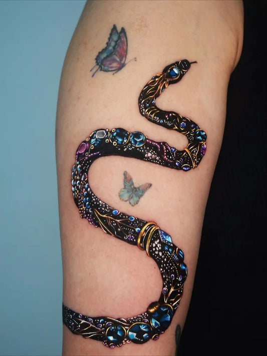 Big Colorful Snake with Butterflies Tattoo on Women Arm by @txttoo