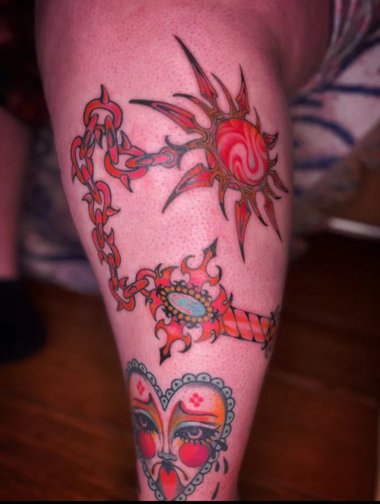 Big Colorful Sun Chain Key Tattoo on Women Thigh by @swamp.blossom