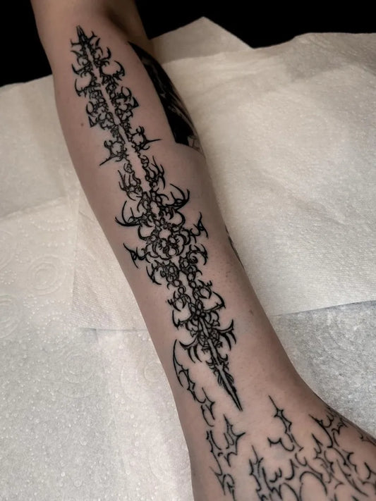 Big Cyber Sigilism Spikes on Women Arm Tattoo by @keri.vacant.tattoo