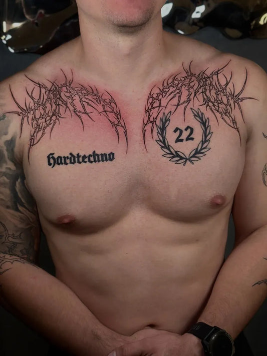 Big Cyber Sigilism Wings with Laurel Wreath and Text on Men Chest Tattoo by @nika_tatts