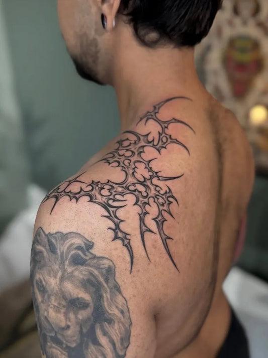 Big Cyber Sigilism and Tribal Wings on Men Shoulder Tattoo by @oldfaithful_tattoo