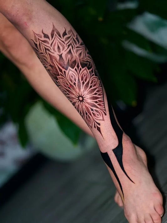 Big Dotwork Mandala and Floral Tattoo on Women Leg by @themiestattoo