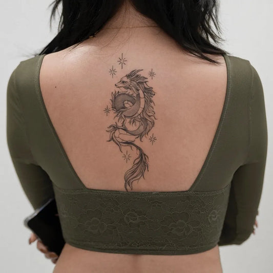 Big Fantasy Dragon on Women Back Tattoo by @beetattoo.studio