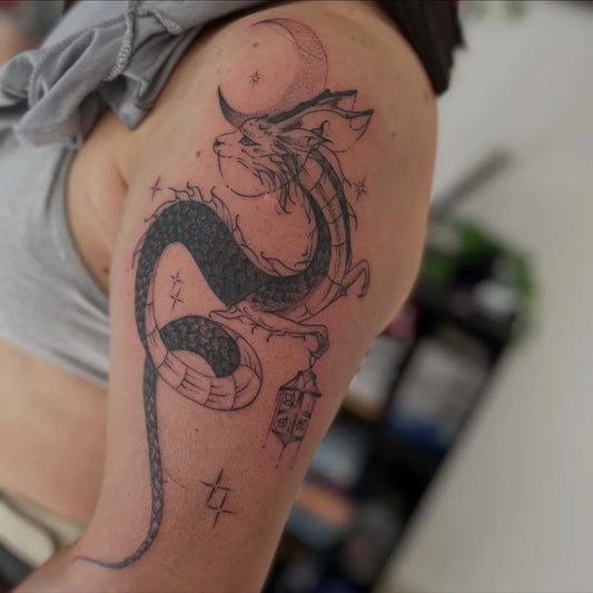 Big Fantasy Dragon with Moon and Lantern on Women Arm Tattoo by @glammytattoo_