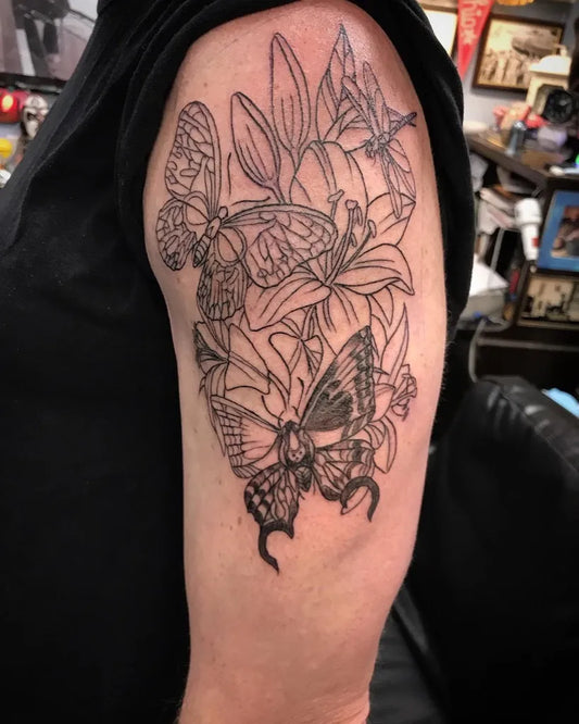 Fine Line Butterflies and Lilies on Men Upper Arm Tattoo by @sloweace