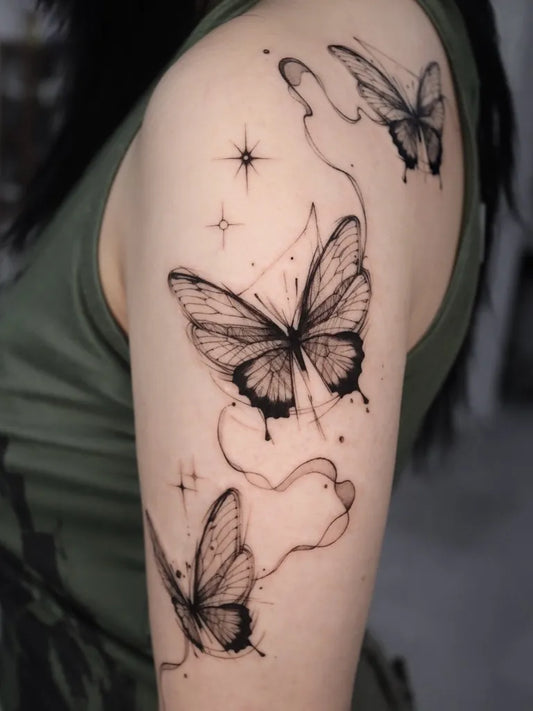 Big Fine Line Butterflies and Stars on Women Arm Tattoo by @tattoo_chamsae