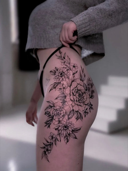 Big Fine Line Floral Bouquet on Women Thigh Tattoo by @ohiko.tattoo