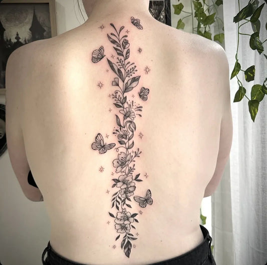 Big Fine Line Floral Butterflies on Women Spine Tattoo by @scarlett_ink_tattoos