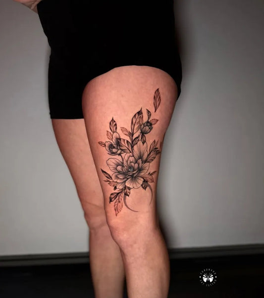 Big Fine Line Flower Branch with Leaves on Women Thigh Flower Tattoo by @coronadotattoo