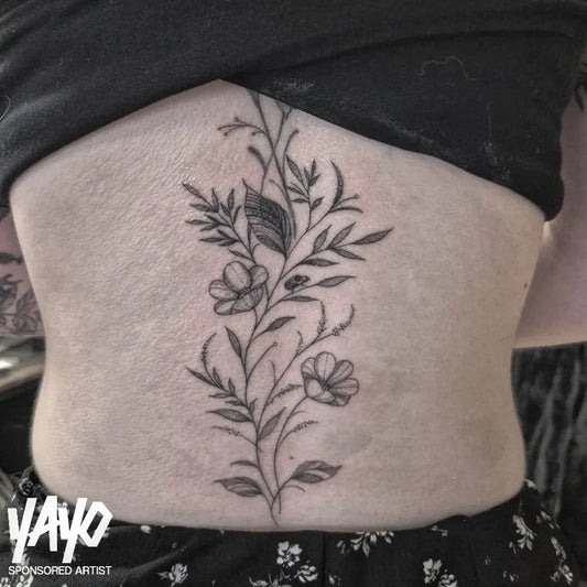 Big Fine Line Flowers and Leaves on Women Spine Tattoo by @lilyadamstattoos