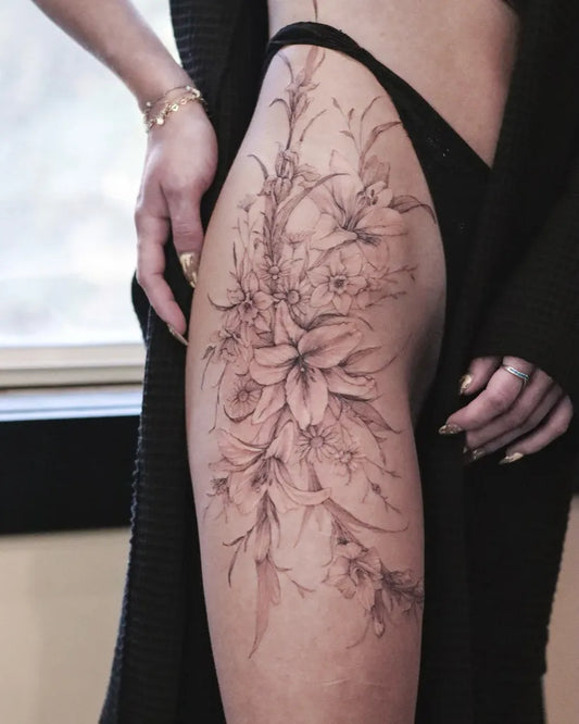 Big Fine Line Flowers and Leaves on Women Thigh Tattoo by @ondo.tattoo