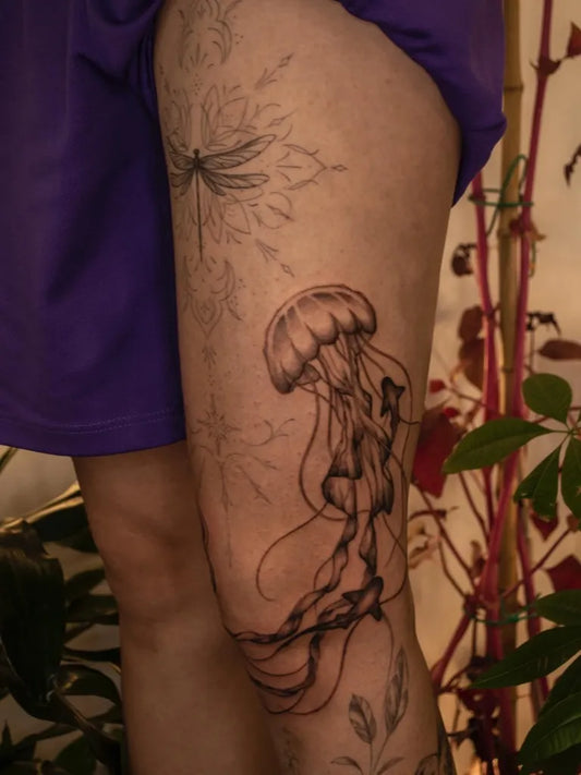 Big Fine Line Jellyfish and Dragonfly Tattoo on Women Thigh by @smile.d.esigns