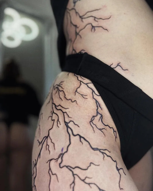 Big Fine Line Lightning Tattoo on Women Hip by @kuba.tattoos