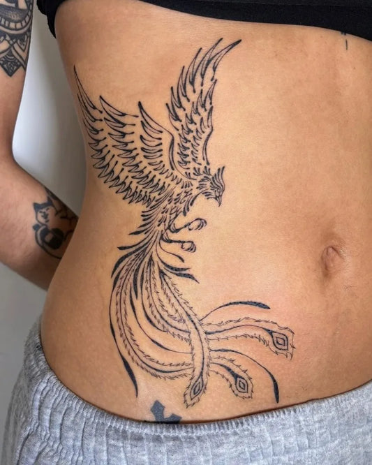 Big Fine Line Phoenix and Peacock Feathers on Women Side Tattoo by @laikintattooss