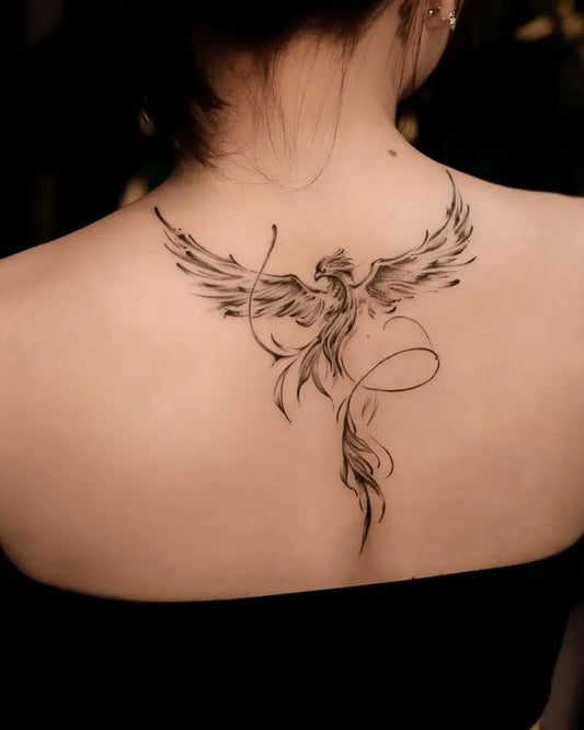 Big Fine Line Phoenix on Women Back Tattoo by @nghe.tattooparlour