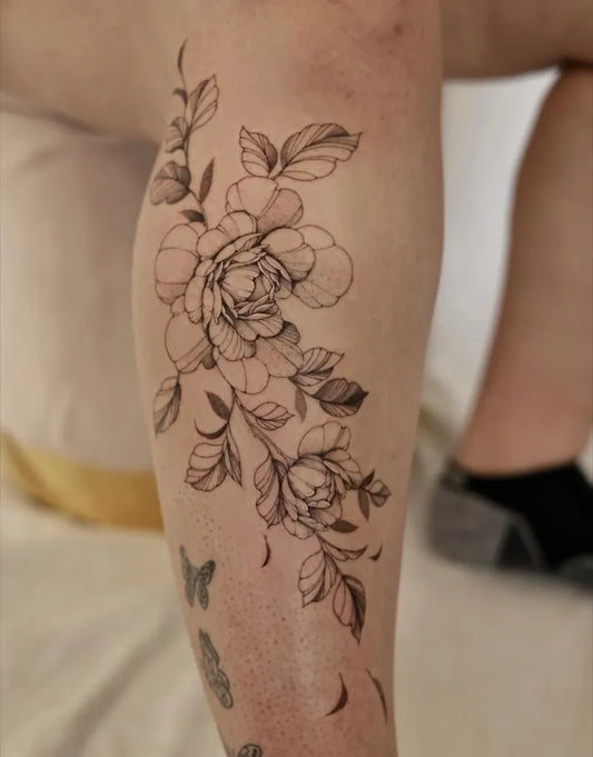 Big Fine Line Rose and Butterfly on Women Thigh Flower Tattoo by @tattoosbyeileen