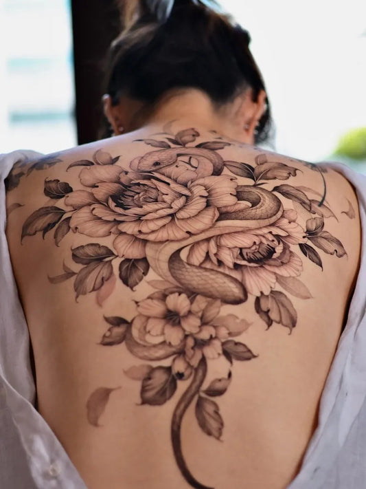 Big Fine Line Rose and Snake on Women Back Tattoo by @maeul.tt