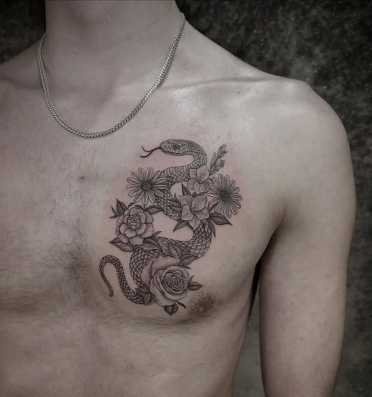 Big Fine Line Snake and Flowers on Men Chest Tattoo by @carmensdarkgallery