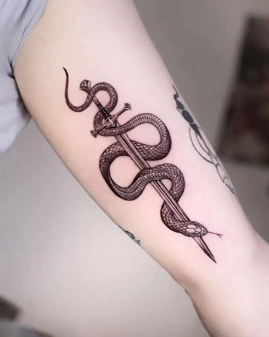 Big Fine Line Snake and Sword on Women Arm Tattoo by @becca.rose.tt