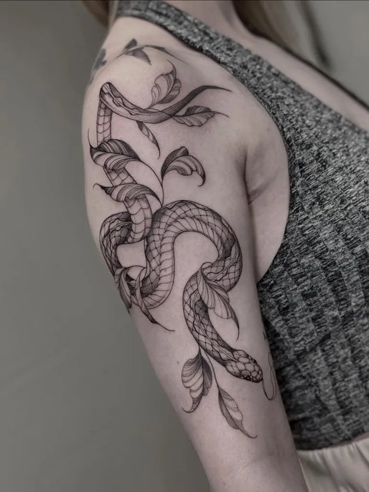 Big Fine Line Snake with Leaves on Women Shoulder Tattoo by @vil_tattoo