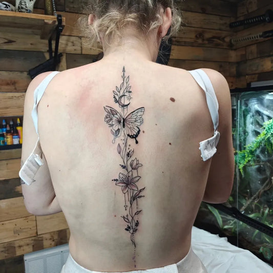 Big FineLine Butterfly Flowers on Women Spine Tattoo by @yazunionink