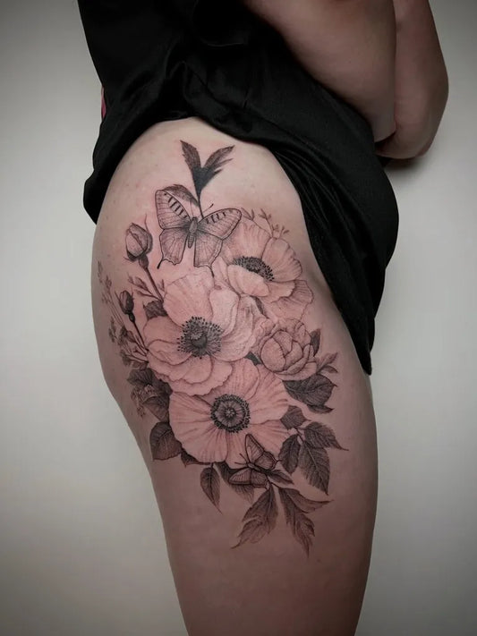 Big FineLine Butterfly Poppy Flowers on Women Thigh Tattoo by @lenalunatattoo