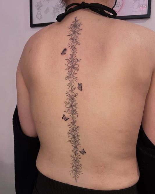 Big FineLine Flowers and Butterflies on Women Spine Tattoo by @lucybethantattoos