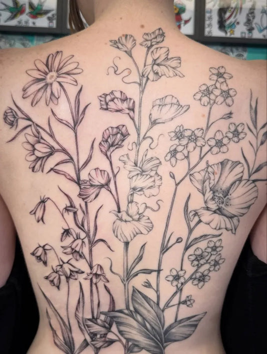 Big FineLine Flowers on Women Back Tattoo by @hannahsenoj