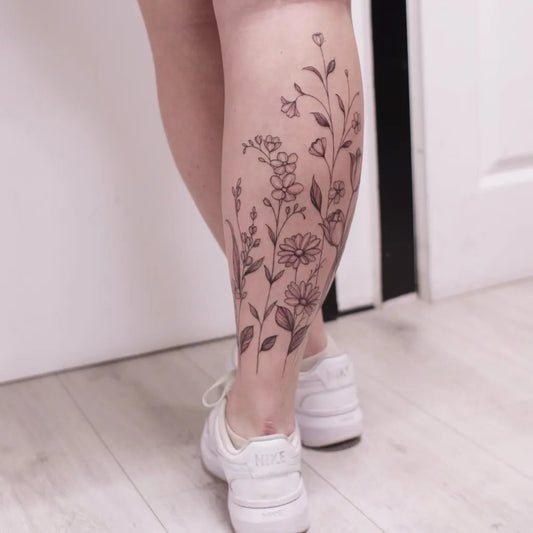 Big Floral Botanical Flowers Leaves on Women Leg Tattoo by @charlotteglatt_tattoos