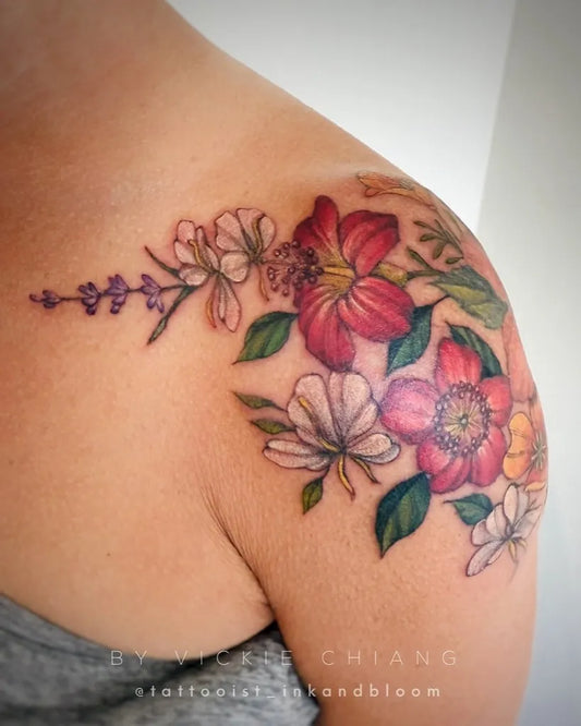 Big Floral Bouquet of Red White and Yellow Flowers on Women Shoulder Flower Tattoo by @tattooist_inkandbloom