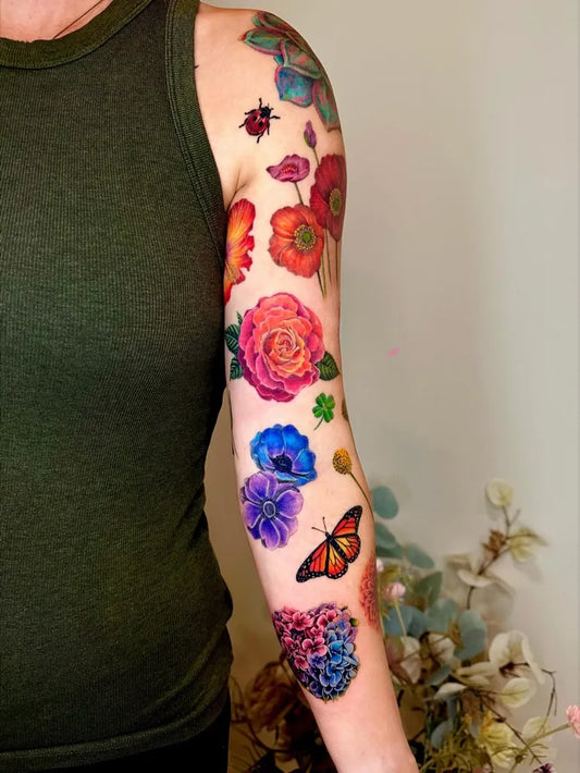 Big Floral Butterfly on Women Arm Sleeve Tattoo by @claire_tattoos_