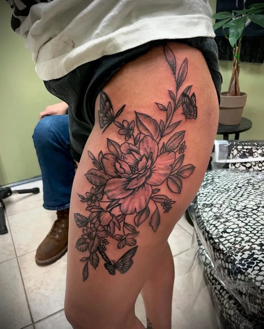 Big Floral Butterfly on Women Thigh Tattoo by @chrisweimanntattoo