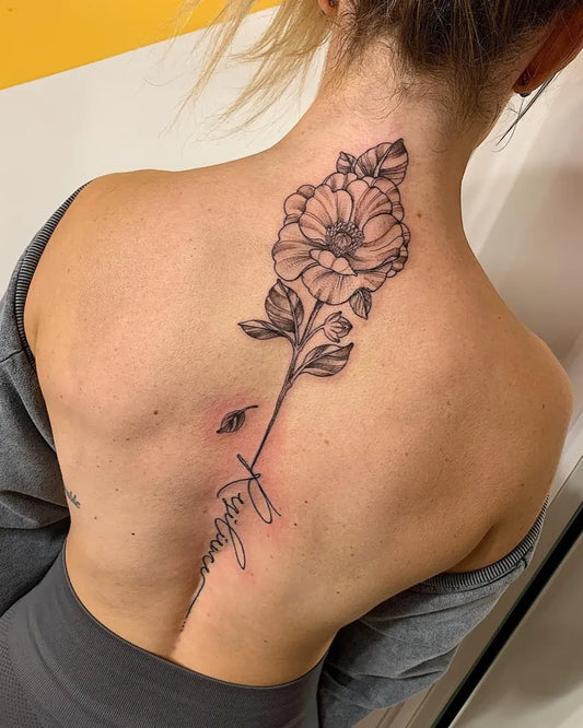Big Floral Faith Word on Women Spine Tattoo by @pip.fox.tattoos