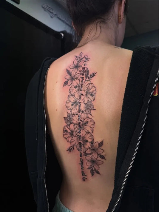 Big Floral Foxglove on Women Spine Tattoo by @stizzls.tats
