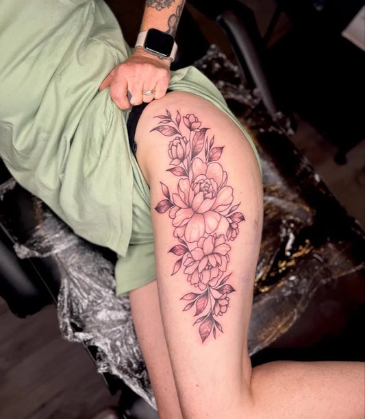 Big Floral Peonies and Leaves on Women Thigh Tattoo by @skinarttattoostudio_