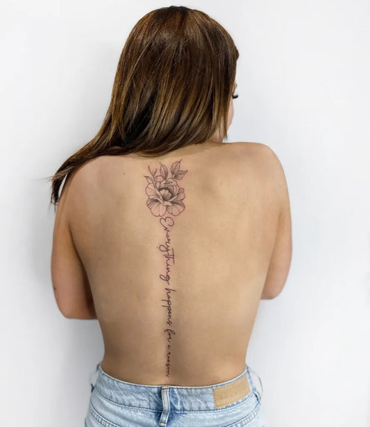 Big Floral Script Flower and Script on Women Spine Tattoo by @cheribear_tattoo