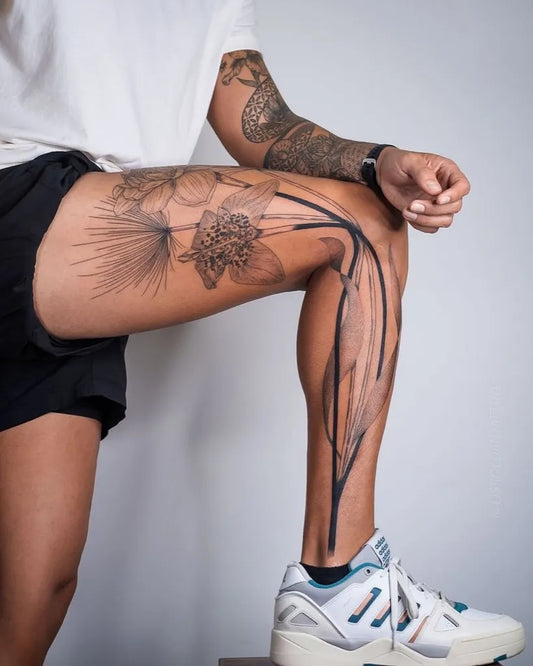 Big Floral Snake Flower on Men Leg Tattoo by @tattooculturemag