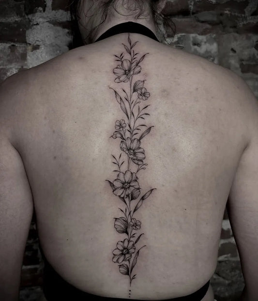 Big Floral Vine on Women Spine Tattoo by @ellaraintattoos
