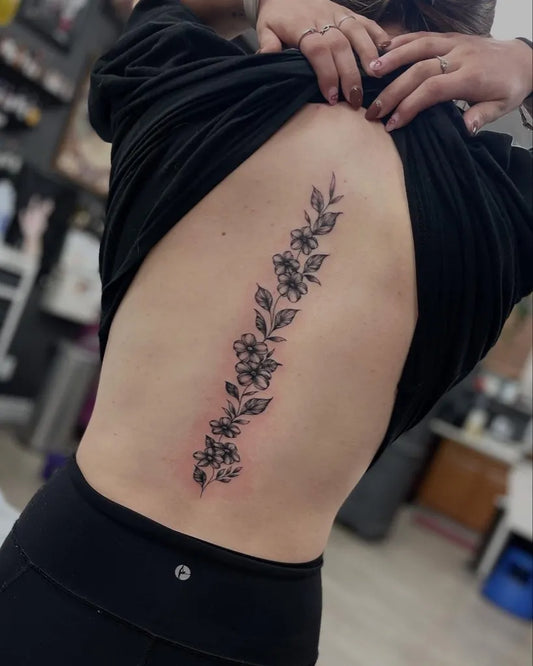 Big Floral Vine on Women Spine Tattoo by @emilycolgantattoos