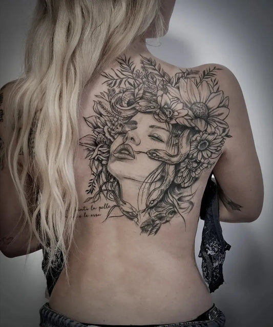 Big Floral Woman Face and Snake on Women Back Tattoo by @nupike.tattoo