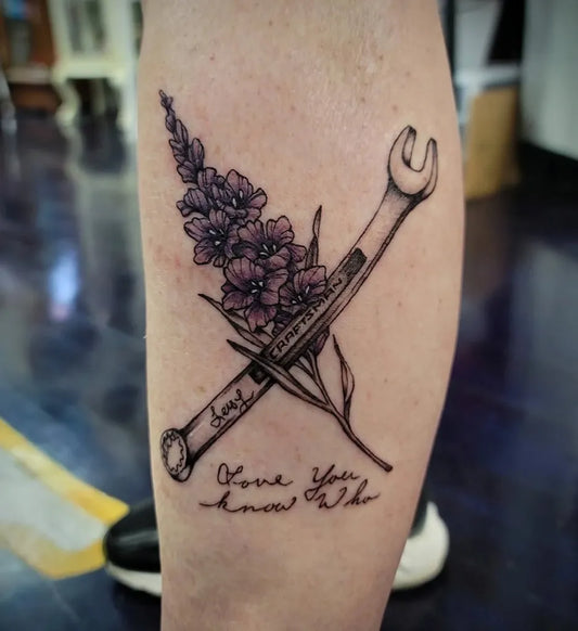 Big Floral Wrench with Text on Women Leg Tattoo by @trickylake